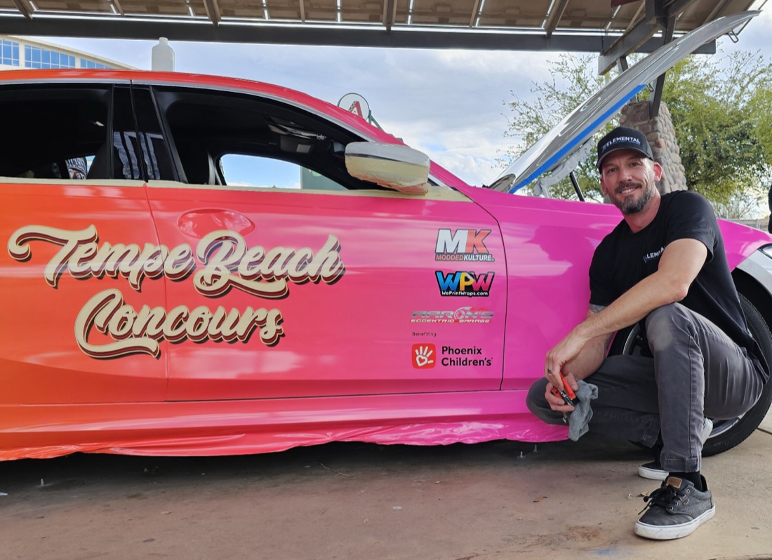 Jason with a wrapped show car at a community event