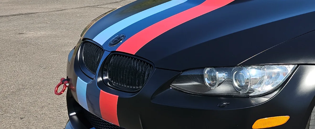 2011 BMW M3 — 3M Satin Black · Reflective M-stripes